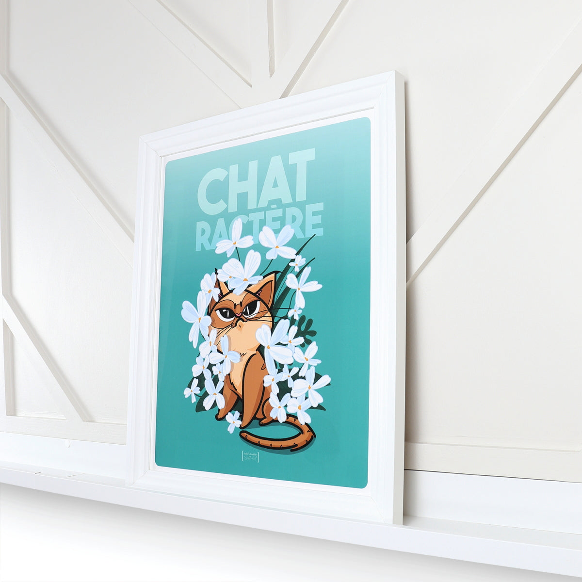 Framed Moody Cat poster on shelf